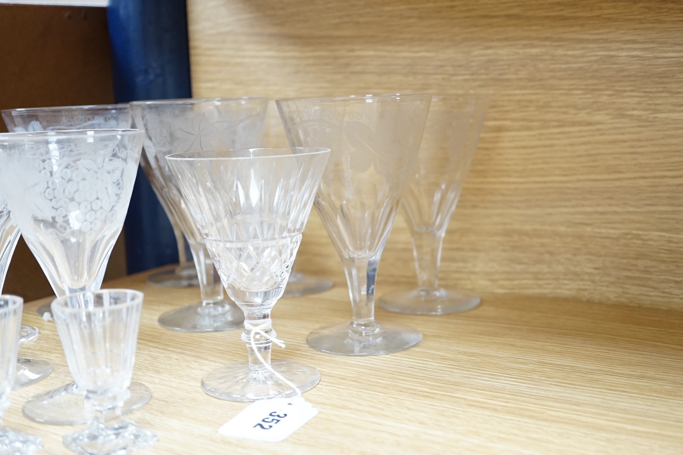 A quantity of engraved and other wine and sherry glasses. Tallest 17cm